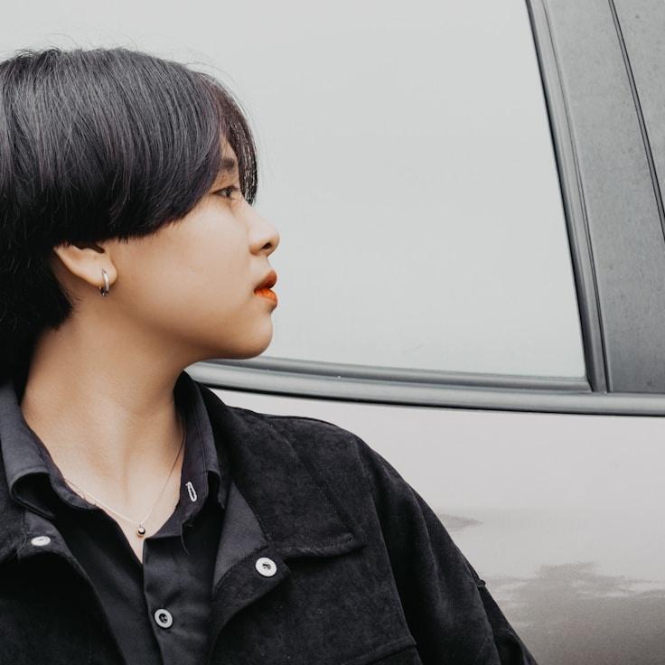 Kaveri Mehta, Lead Design Curator at FieldCommonsPioneer, reviewing corporate floral arrangements